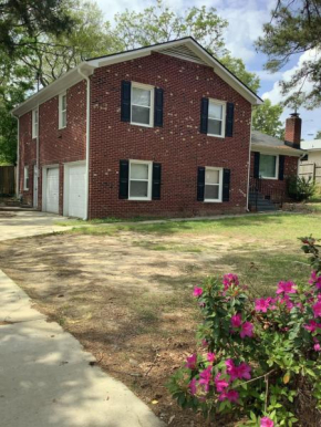 4-bedroom brick home with a full kitchen, king size bed and all the space you need for you and your large family on your getaway.